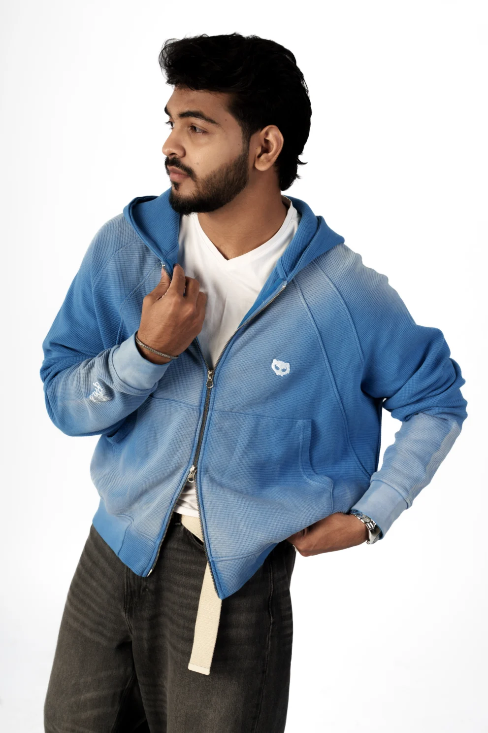 Blue waffle knit oversized hoodie with relaxed fit and zip-up streetwear styling